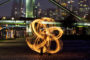 Feuerperformance Fire in Motion vor Frankfurter Skyline