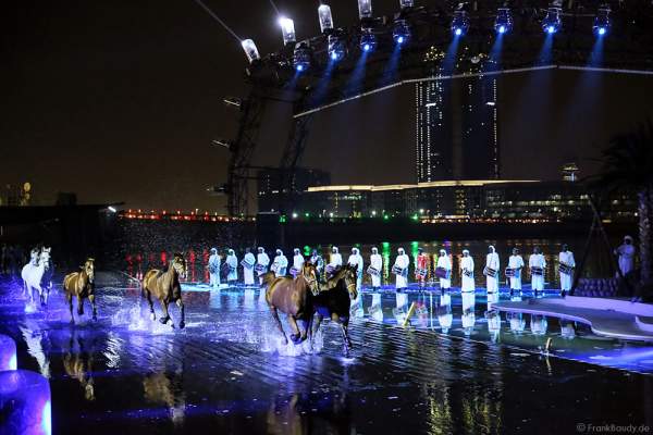 Horses galloping across the submerged stage at UAE 44th National Day 2015 in Dubai, a performance trained from Bedouin horseman - Ali Al Ameri - the horsemaster