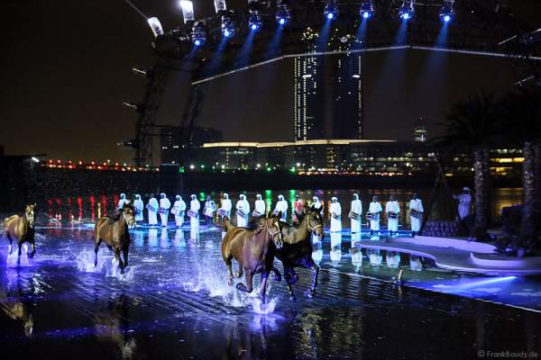 Horses galloping across the submerged stage at UAE 44th National Day 2015 in Dubai, a performance trained from Bedouin horseman - Ali Al Ameri - the horsemaster