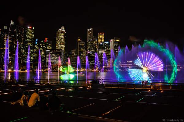 New light and water show SPECTRA with dancing water fountains, water screens and laser at Marina Bay Sands Singapore