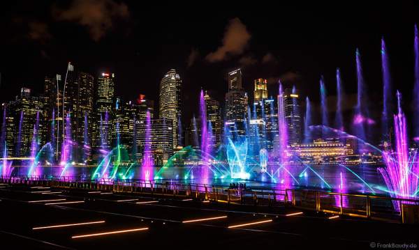 New light and water show SPECTRA with dancing water fountains, water screens and laser at Marina Bay Sands Singapore